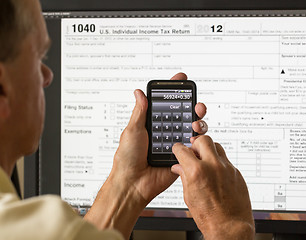 Image showing USA tax form 1040 for year 2012 and calculator