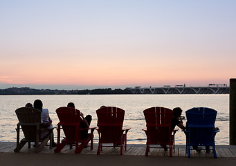 Image showing Tourists watch sunset from National Harbor