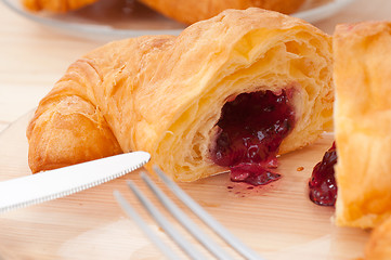 Image showing croissant French brioche filled with berries jam