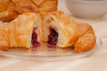 Image showing croissant French brioche filled with berries jam