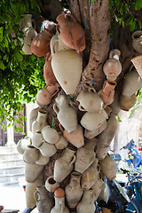 Image showing Hanging pots at market, a traditional pottery Tunisia 