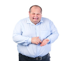 Image showing Unhappy Fat Man in a Blue Shirt