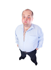 Image showing Fat Man in a Blue Shirt, Contorts Antics, wide-angle top view