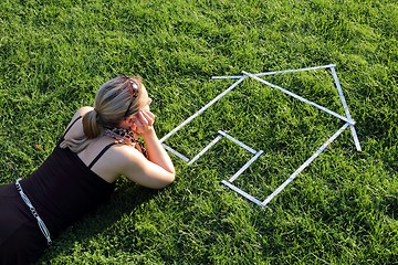 Image showing Woman dreaming from a house in a meadow