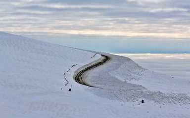 Image showing Dirt road in the snowy mountains