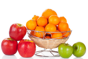 Image showing bucket of apples and oranges isolated on white