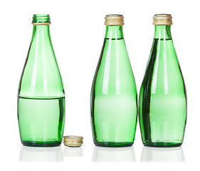 Image showing three soda water bottles isolated on white