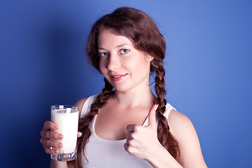 Image showing woman enjoying a glass of milk 