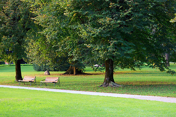 Image showing Green park with iwo benches