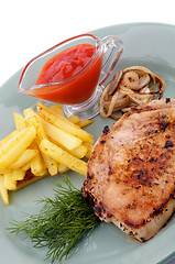 Image showing Pork Steak, French Fries and Grilled Onions