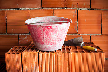 Image showing Trowel, bucket and bricks