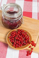 Image showing Jam with berries of a red currant on a table.