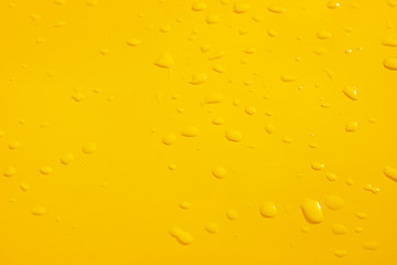 Image showing raindrops on the yellow metal