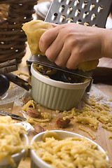 Image showing Detail of child hands making plum tart