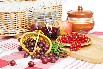 Image showing Jam with berries of red currant and gooseberry on the table