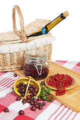 Image showing Jam with berries of red currant and gooseberry on the table