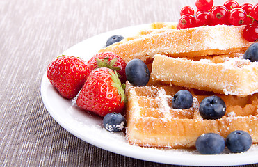 Image showing sweet fresh tasty waffles with mixed fruits isolated