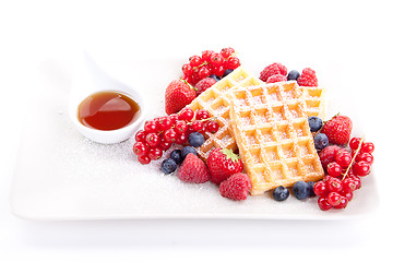 Image showing sweet fresh tasty waffles with mixed fruits isolated