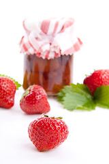 Image showing deliscious strawberry jam with fresh fruits isolated