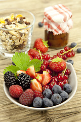 Image showing fresh tasty berry collection on table in summer