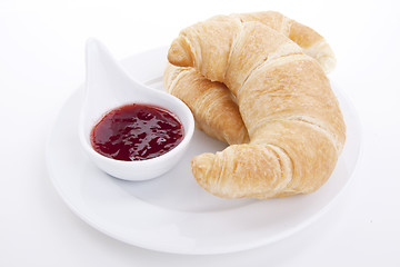 Image showing deliscios fresh croissant with strawberry jam isolated