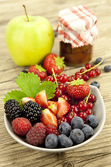 Image showing fresh tasty berry collection on table in summer