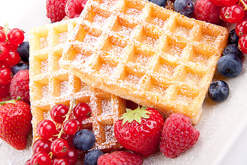 Image showing sweet fresh tasty waffles with mixed fruits isolated