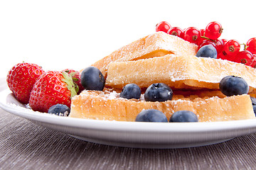 Image showing sweet fresh tasty waffles with mixed fruits isolated