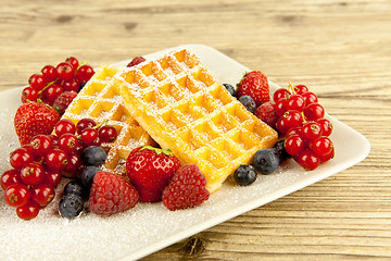 Image showing fresh tasty waffer with powder sugar and mixed fruits