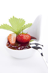 Image showing deliscious strawberry jam with fresh fruits isolated