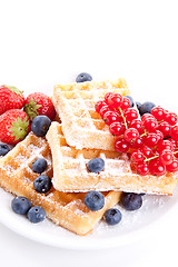 Image showing sweet fresh tasty waffles with mixed fruits isolated