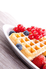 Image showing sweet fresh tasty waffles with mixed fruits isolated