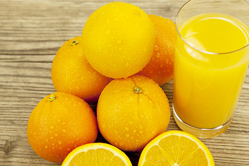 Image showing fresh and  healthy tasty orange juice on table