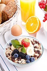 Image showing deliscious healthy breakfast with flakes and fruits isolated