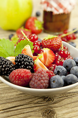 Image showing fresh tasty berry collection on table in summer