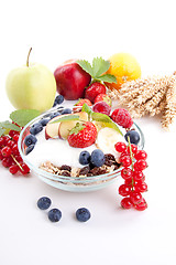 Image showing deliscious healthy breakfast with flakes and fruits isolated