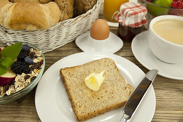 Image showing traditional french breakfast on table in morning