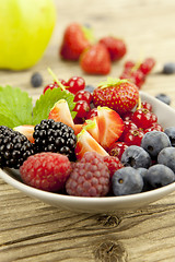 Image showing fresh tasty berry collection on table in summer