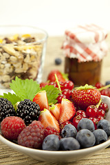 Image showing fresh tasty berry collection on table in summer