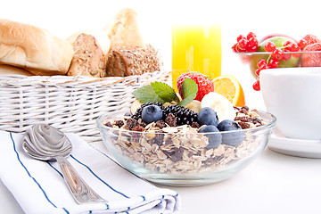 Image showing deliscious healthy breakfast with flakes and fruits isolated