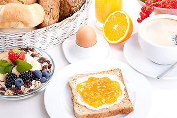 Image showing breakfast table with toast and orange marmelade isolated