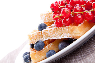 Image showing sweet fresh tasty waffles with mixed fruits isolated