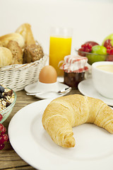 Image showing traditional french breakfast on table in morning