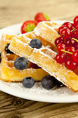 Image showing fresh tasty waffer with powder sugar and mixed fruits