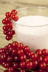 Image showing deliscious fresh currant yoghurt shake dessert on table