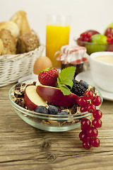 Image showing tasty breakfast with flakes and fruits in morning