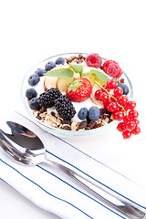 Image showing deliscious healthy breakfast with flakes and fruits isolated