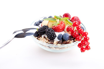 Image showing deliscious healthy breakfast with flakes and fruits isolated