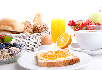 Image showing breakfast table with toast and orange marmelade isolated