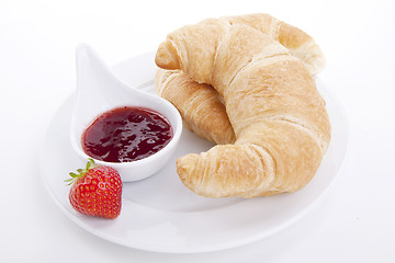 Image showing deliscios fresh croissant with strawberry jam isolated